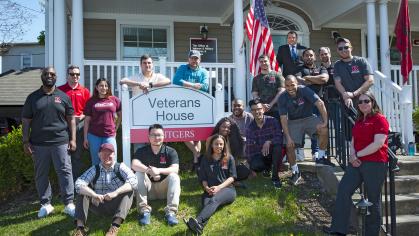 Veterans posing in front of Veterans House