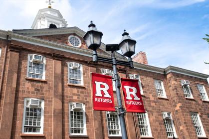 Old Queens building with the Rutgers flags on the lamppost