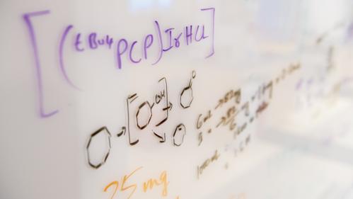 scientific formula on whiteboard