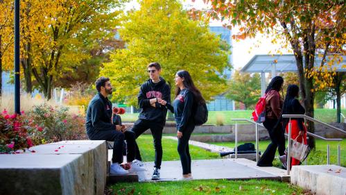 Maliha Rahman (RBS '23), Abhi Samudrala (RBS '23), and Eric Soares (SAS '25), pose for a photo on the Livingston campus