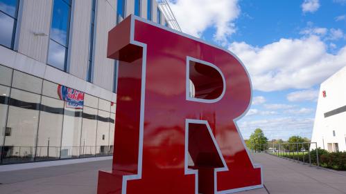 red block R against a blue sky