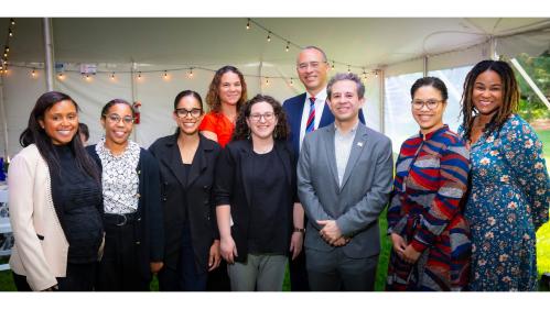 (left to right) Camara Epps (daughter of Cheryl Wall) stands with Ashaki Rouff, Ramona Ross, Maribel Vazquez, Michal Raucher, Arturo Osorio-Fernandez, Kendra Boyd, and Tamara Nelson, the inaugural recipients of the 2024–25 Cheryl Wall Faculty Fellowships, as they pose with President Holloway at the Faculty Year-End Award ceremony