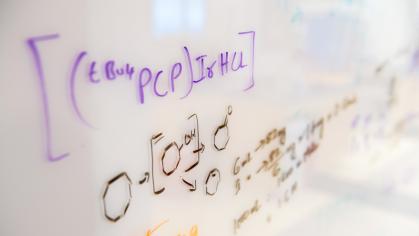 Formulas written on white board