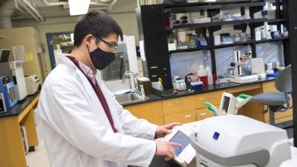 Postdoctoral fellow conducts research in the lab.