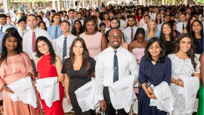 group of New Jersey Medical students holding white coats