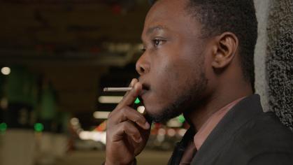 African American man smoking a cigarette