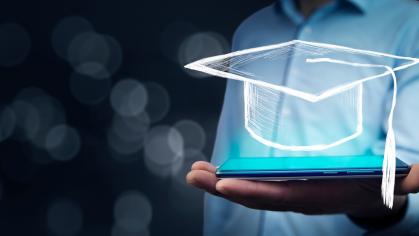 man holding a motarboard on top of a computer in his hand
