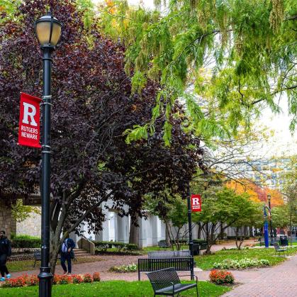 student walking on the Rutgers-Newark campus
