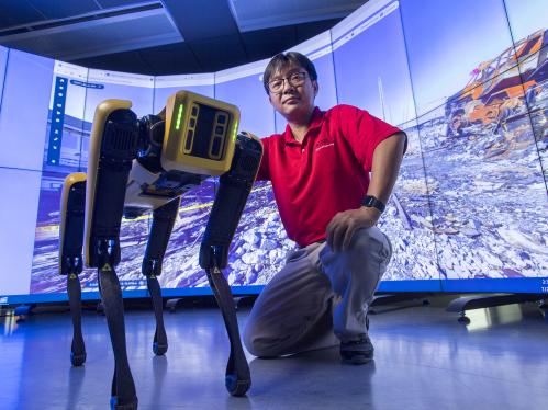 Rutgers professor Jie Gong is part of a team examining ways to automate infrastructure inspection projects in a way that is efficient, safe, and accurate using technology such as Spot, the mobile robotic dog.
