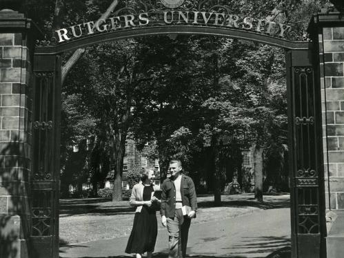 two students pass under the class of 1883 gates in 1952