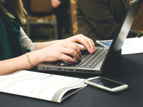 Woman Writing using a computer