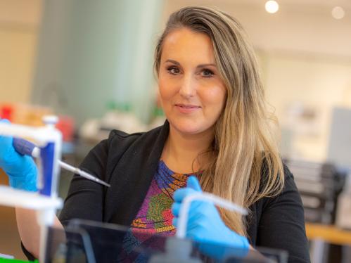 Victoria Abraira standing in a lab