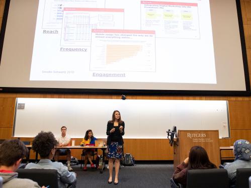 Stacy Smollin Schwartz giving a lecture to students in a lecture hall