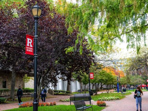 student walking on the Rutgers-Newark campus