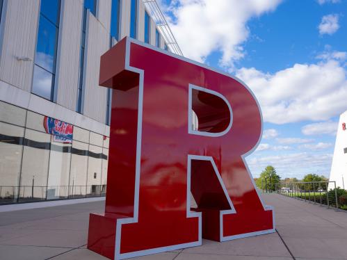 red block R against a blue sky