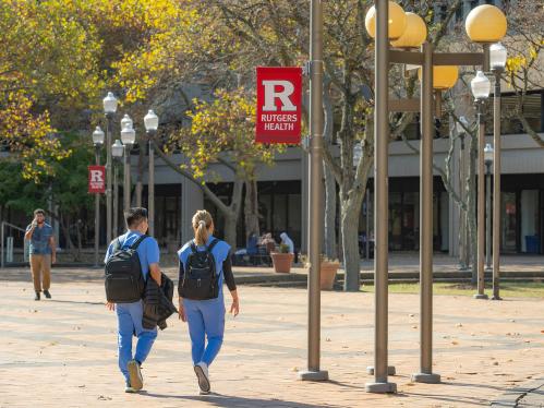 two students walking on the Rutgers Health Campus in Newark