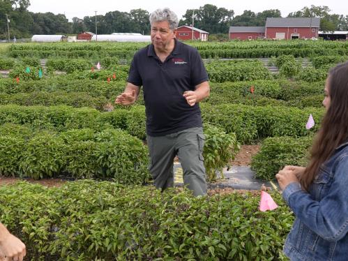 James Simon in the field with two students