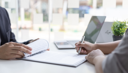 Woman signing paper