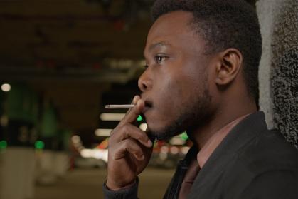 African American man smoking a cigarette